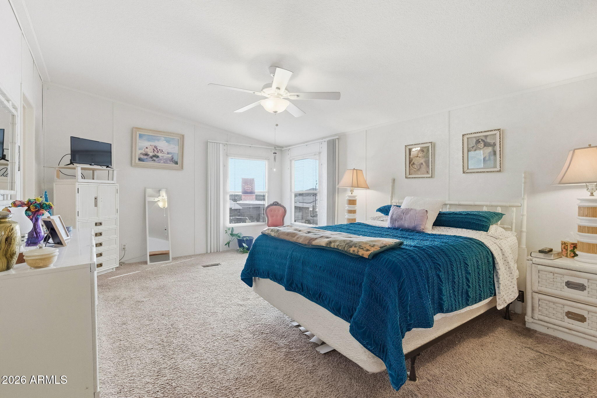 13202 North 19th Way Phoenix, AZ 85022 - Photo 10 of 20 a bedroom with a bed and a chandelier