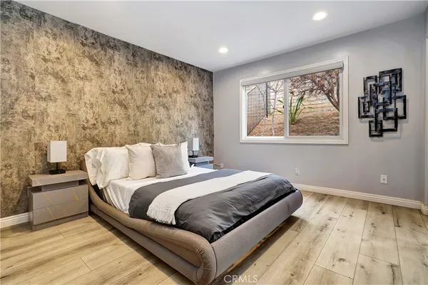 a bathroom with a shower sink and mirror