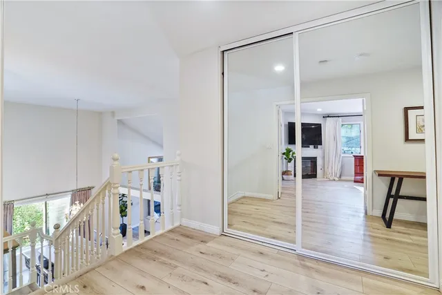 a bed room with a bed and a large window