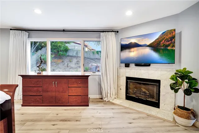 a spacious bedroom with a large bed and a flat screen tv