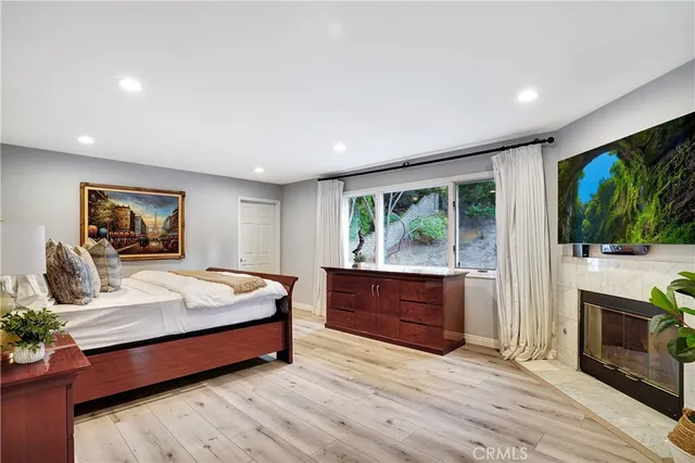 a bedroom with a bed and a desk