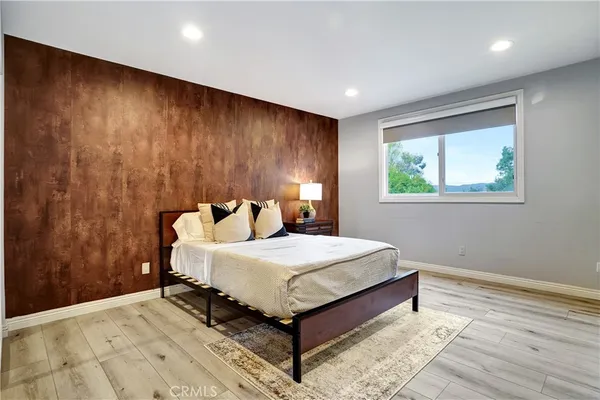 a bedroom with bed and window