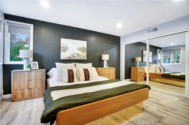 a bedroom with a bed and a dresser