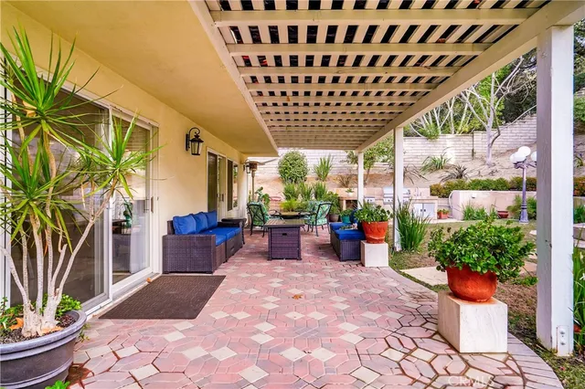 a outdoor living space with patio furniture and garden view