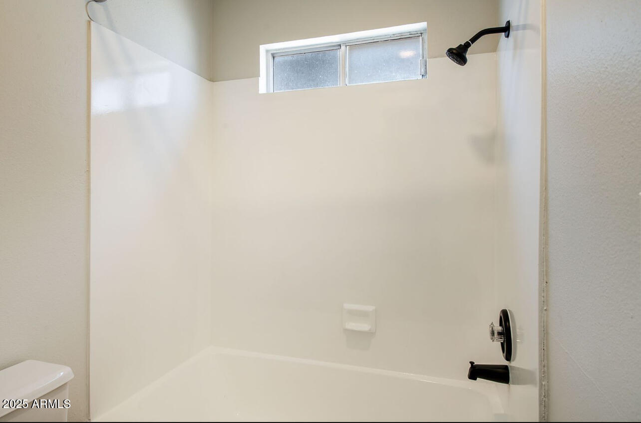 1861 N Spring Mesa, AZ 85203 - Photo 11 of 29 a bathroom with a bathtub