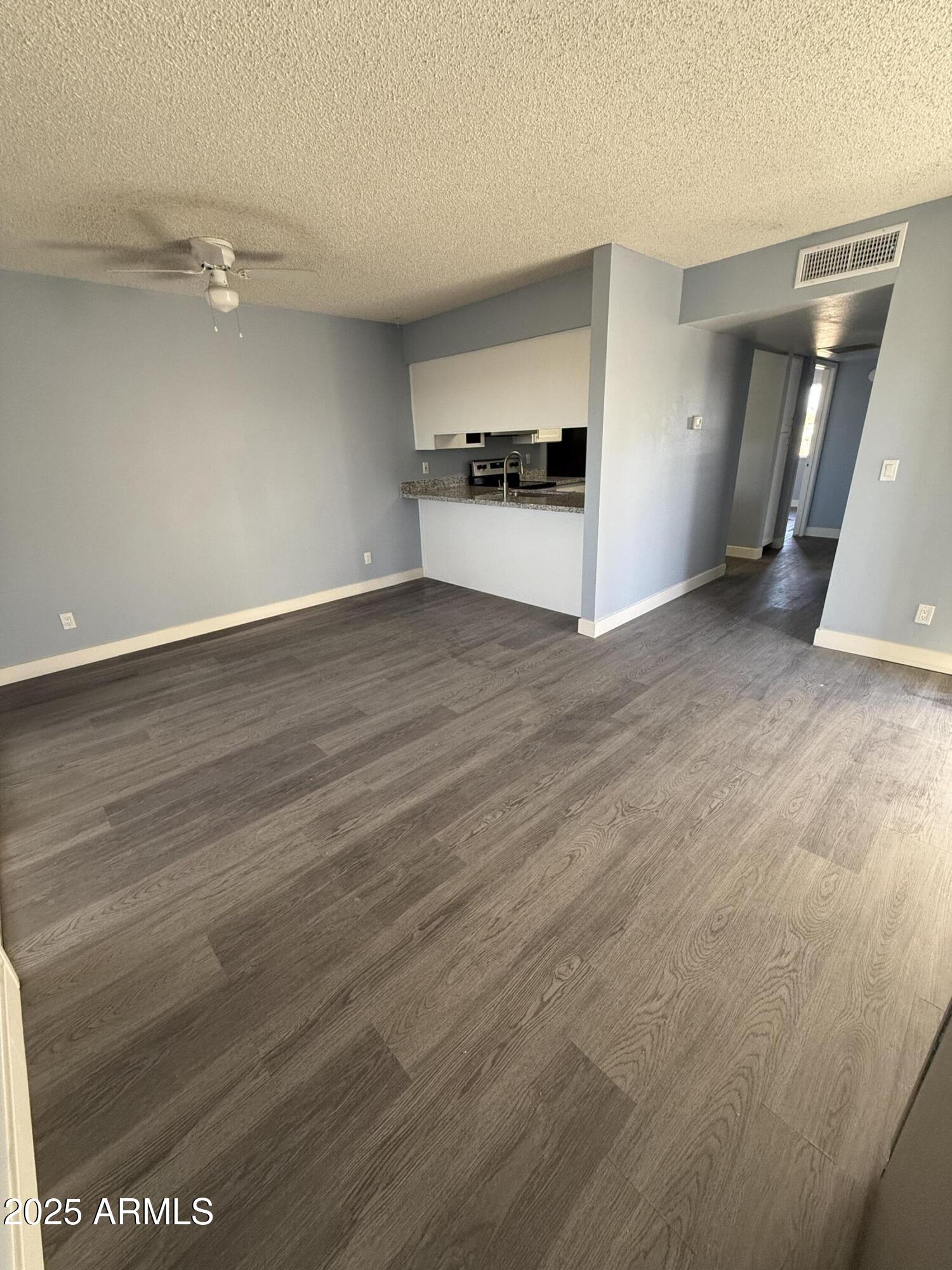 1861 N Spring Mesa, AZ 85203 - Photo 19 of 29 wooden floor in an empty room