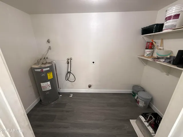a bathroom with a granite countertop sink a mirror and a vanity