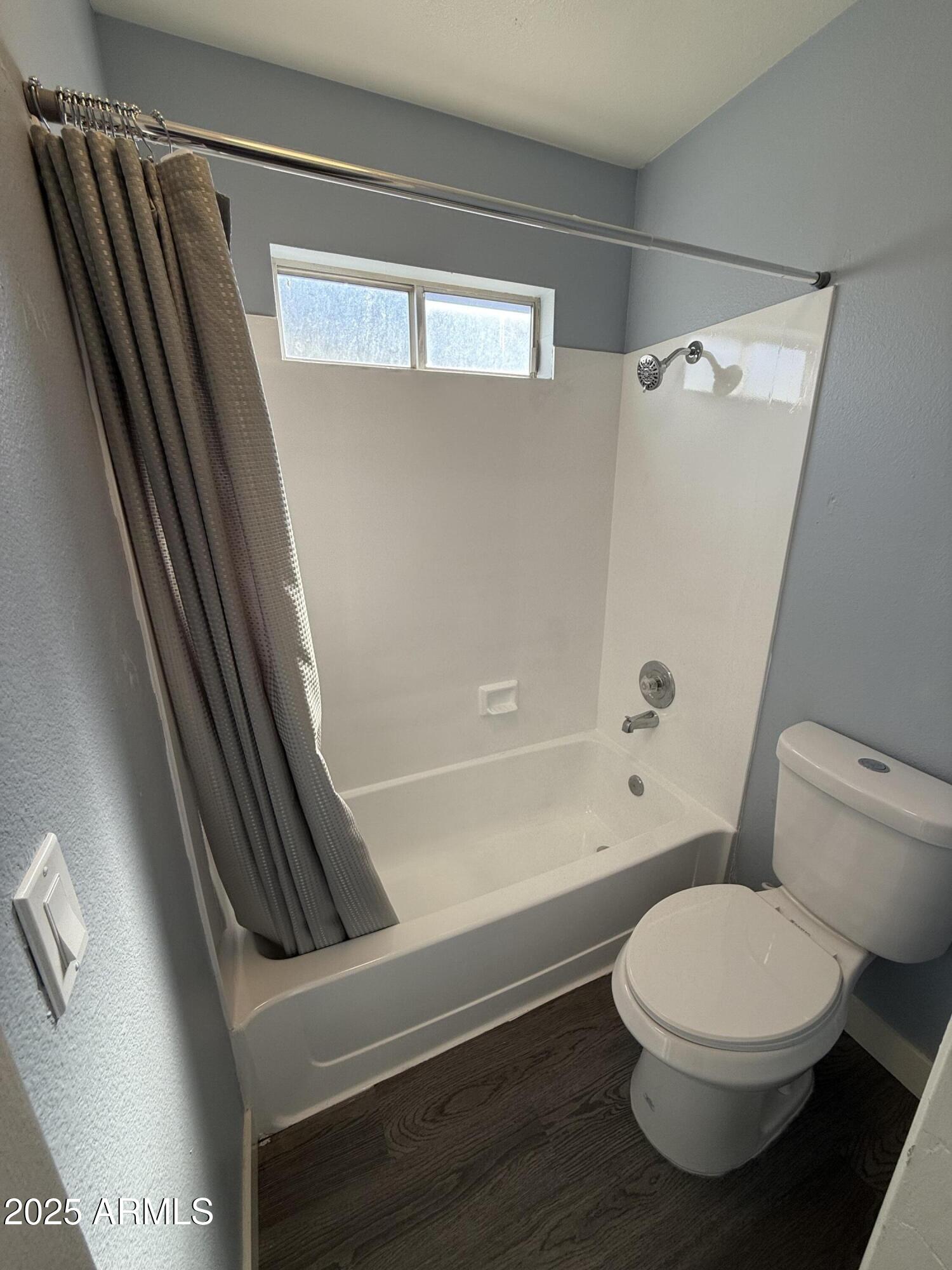 1861 N Spring Mesa, AZ 85203 - Photo 24 of 29 a bathroom with a toilet and a bathtub