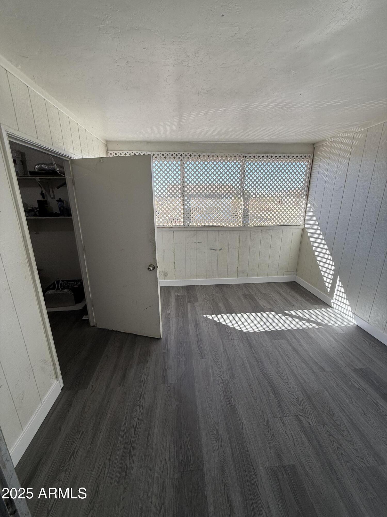 1861 N Spring Mesa, AZ 85203 - Photo 27 of 29 wooden floor in an empty room with a window