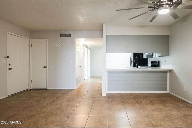 a view of a kitchen with a sink