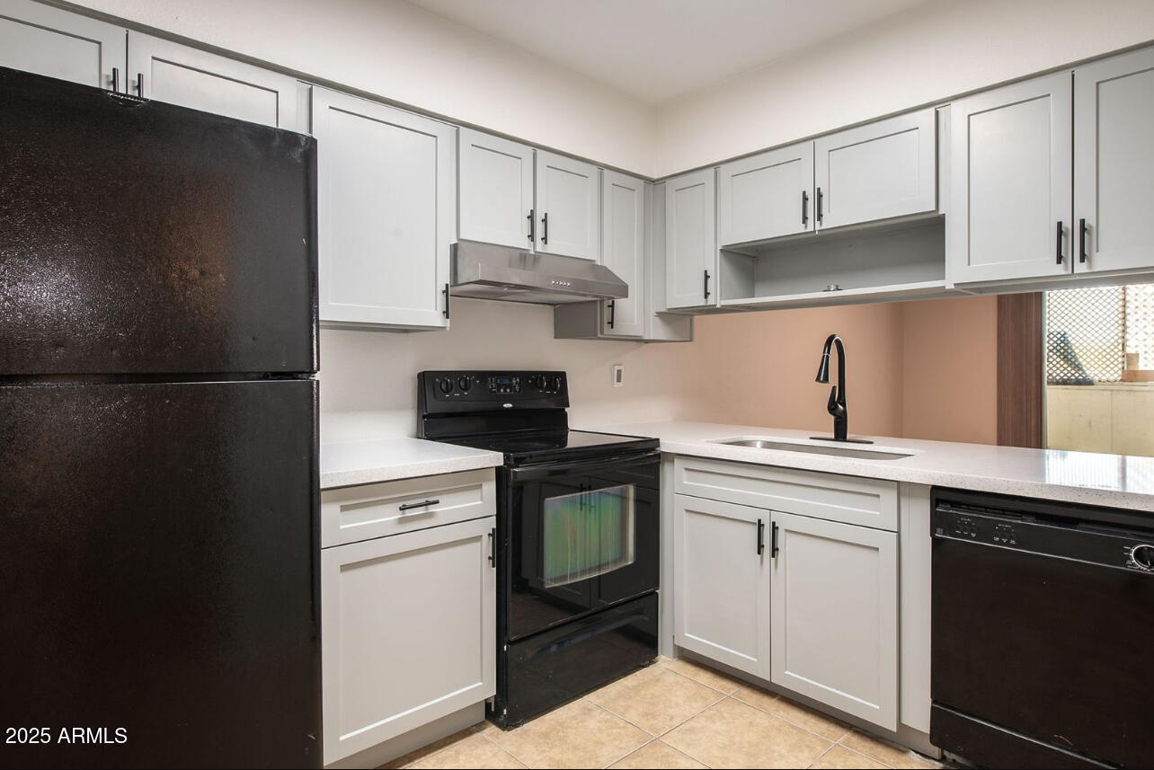 1861 N Spring Mesa, AZ 85203 - Photo 5 of 29 a kitchen with cabinets appliances and a sink