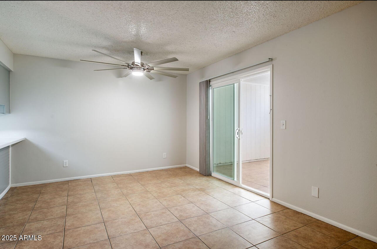 1861 N Spring Mesa, AZ 85203 - Photo 7 of 29 an empty room with fan and windows