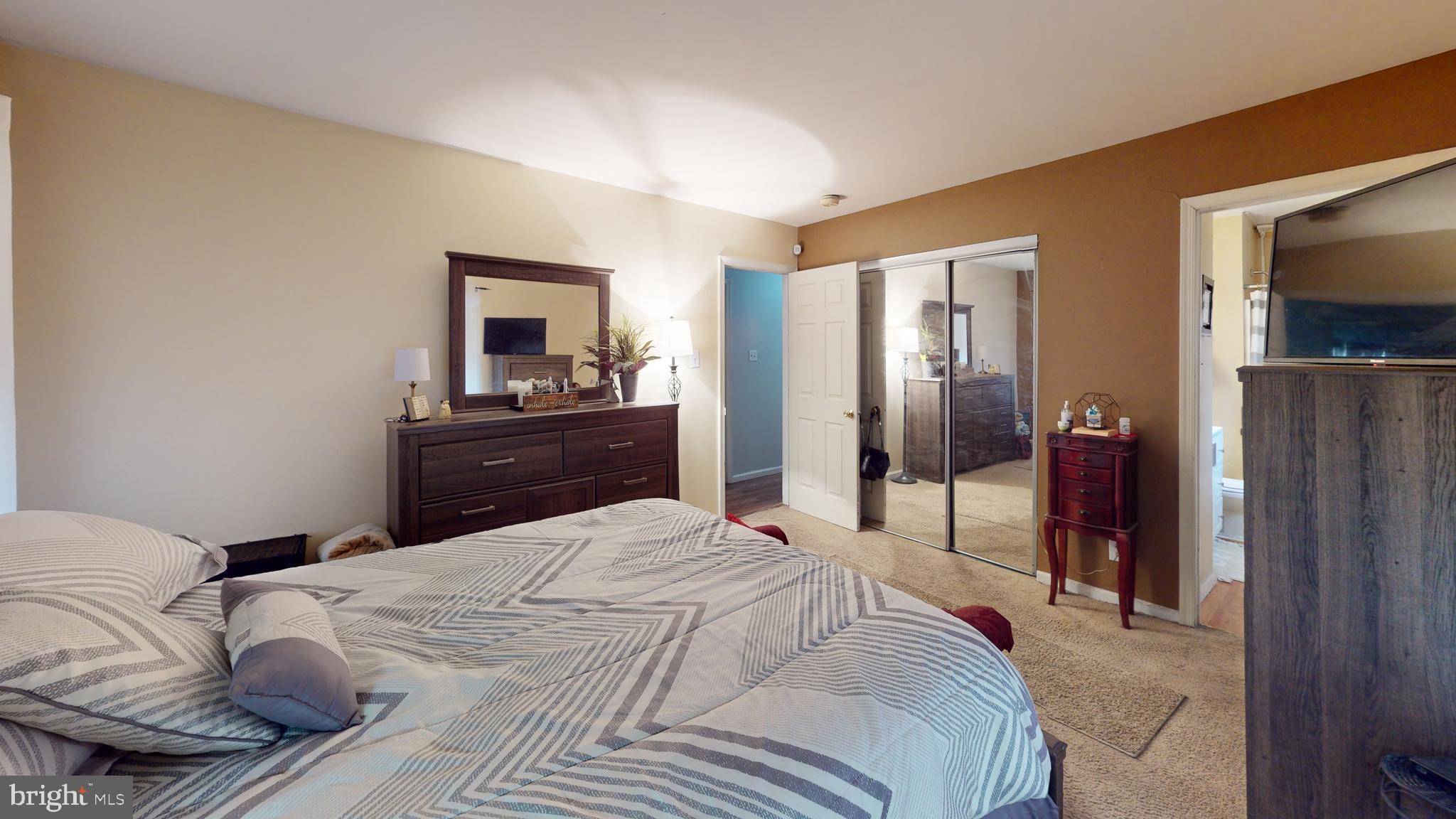 1121 Robin Terrace Millville, NJ 08332 - Photo 15 of 29 a bedroom with a bed and a dresser