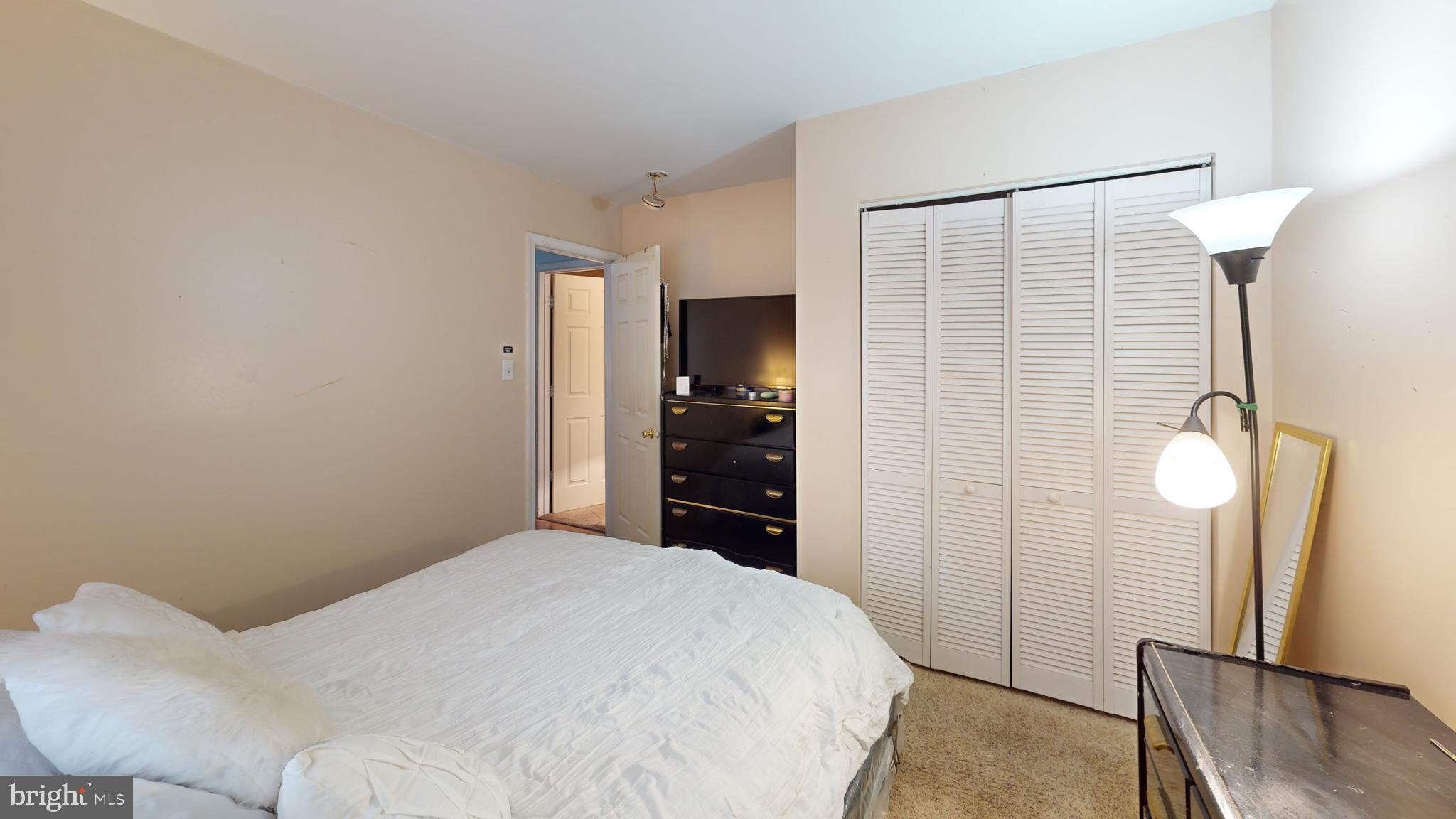 1121 Robin Terrace Millville, NJ 08332 - Photo 19 of 29 a bedroom with a bed and a mirror