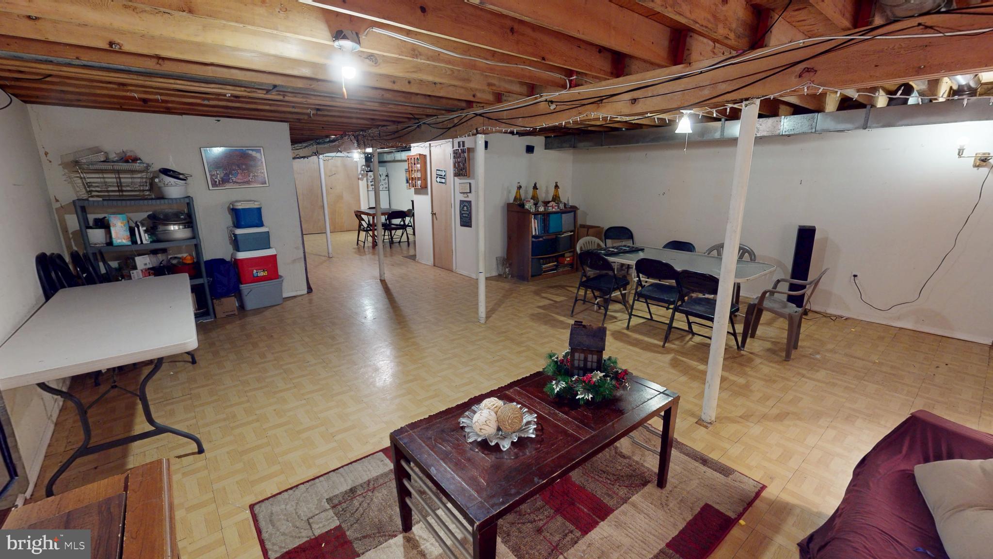 1121 Robin Terrace Millville, NJ 08332 - Photo 23 of 29 a living room with lots of furniture and gym equipment