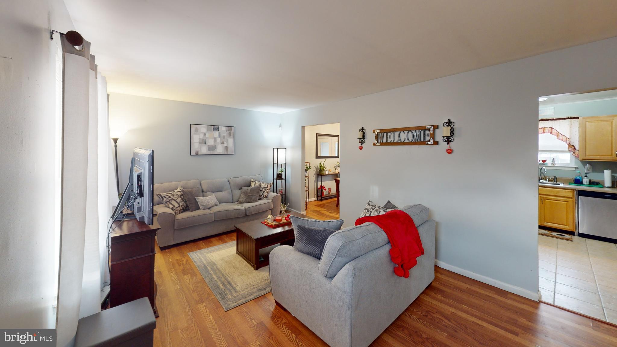 1121 Robin Terrace Millville, NJ 08332 - Photo 5 of 29 a living room with furniture and a flat screen tv