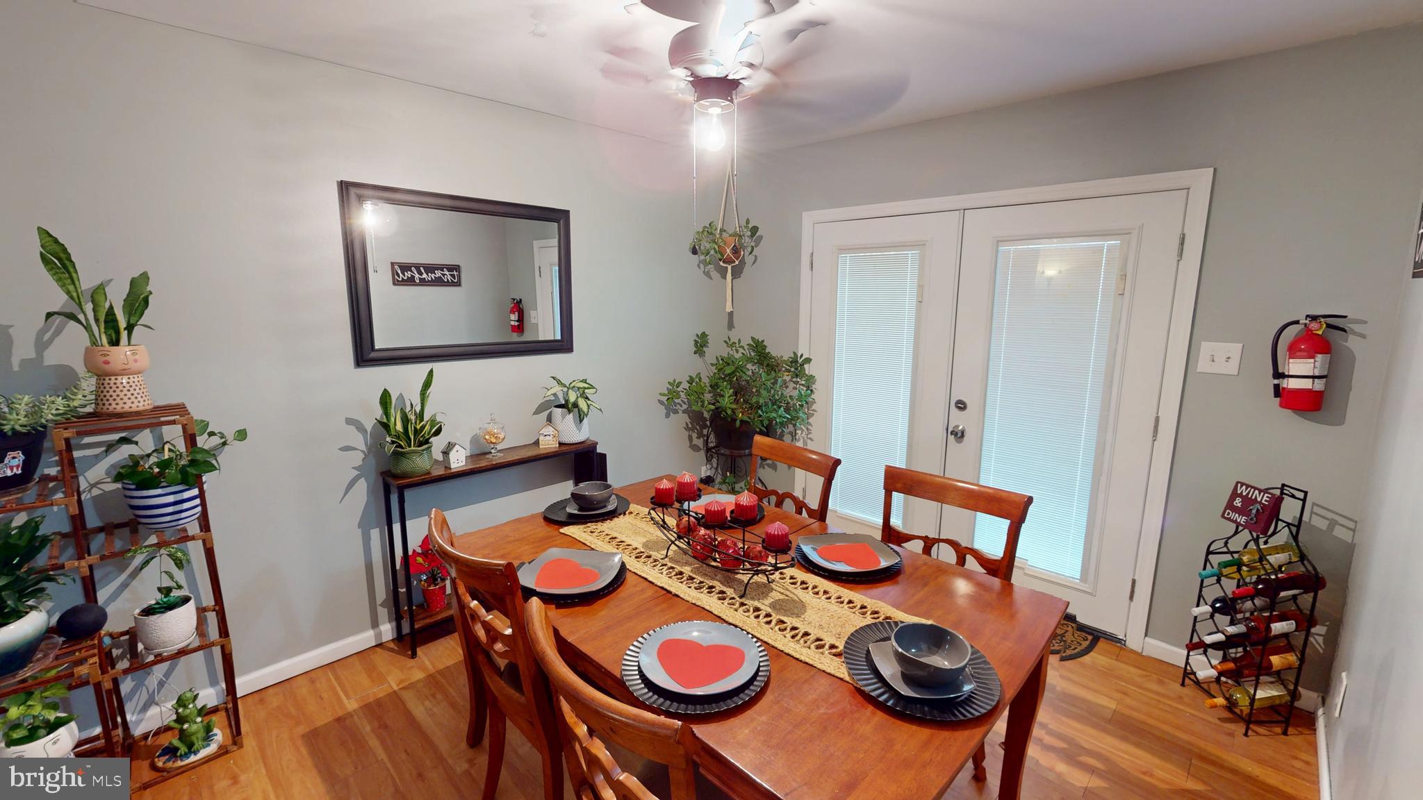 1121 Robin Terrace Millville, NJ 08332 - Photo 9 of 29 a view of a dining room with furniture wooden floor and a chandelier