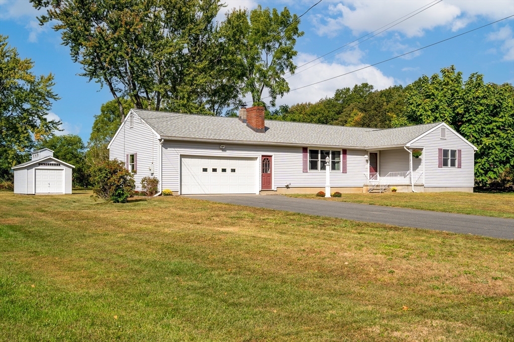 26 Brook Street Easthampton, MA 01027 - Photo 1 of 27 a front view of a house with swimming pool