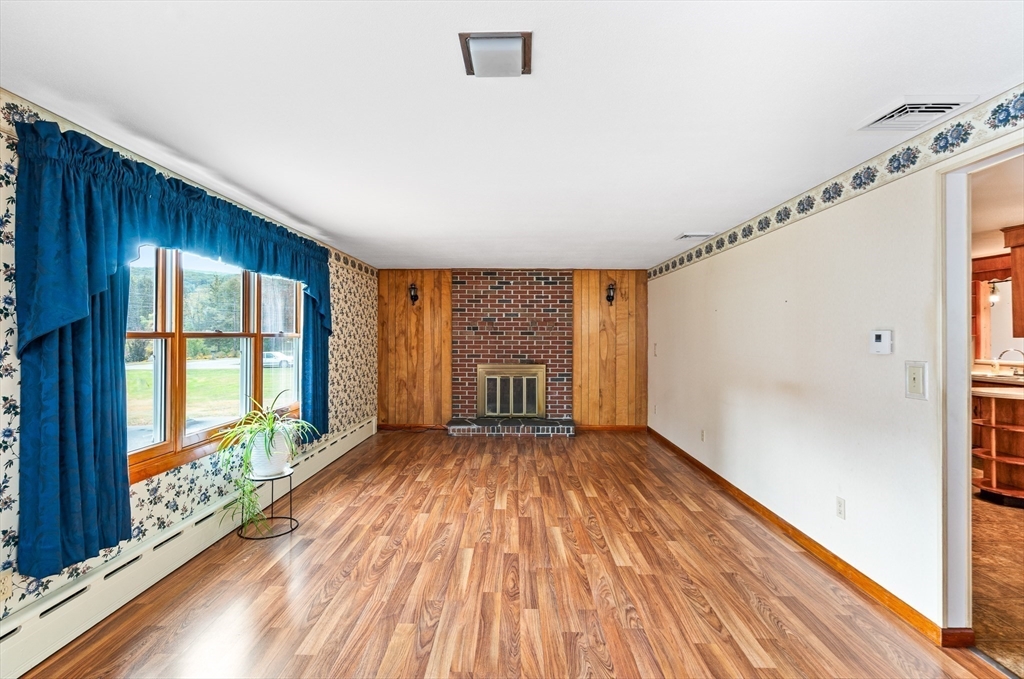 26 Brook Street Easthampton, MA 01027 - Photo 15 of 27 a view of an empty room with wooden floor and a window