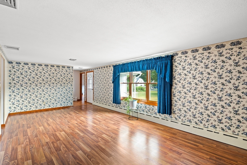26 Brook Street Easthampton, MA 01027 - Photo 16 of 27 wooden floor in an empty room with a window