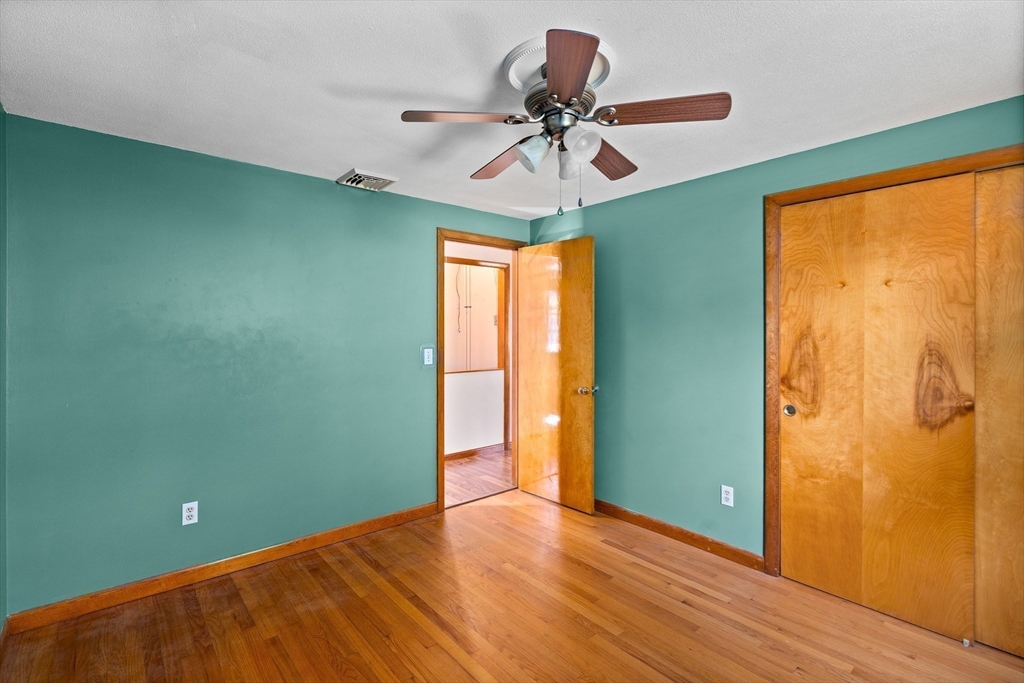 26 Brook Street Easthampton, MA 01027 - Photo 21 of 27 a view of room with window ceiling fan and hardwood floor
