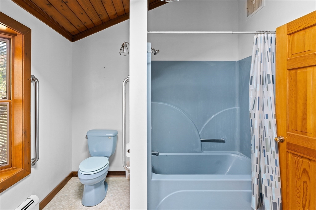 26 Brook Street Easthampton, MA 01027 - Photo 25 of 27 a bathroom with a toilet and a shower