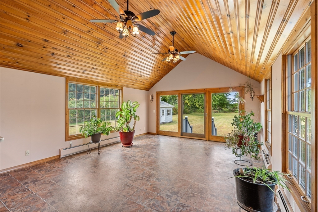 26 Brook Street Easthampton, MA 01027 - Photo 10 of 27 a view of a porch with furniture and garden
