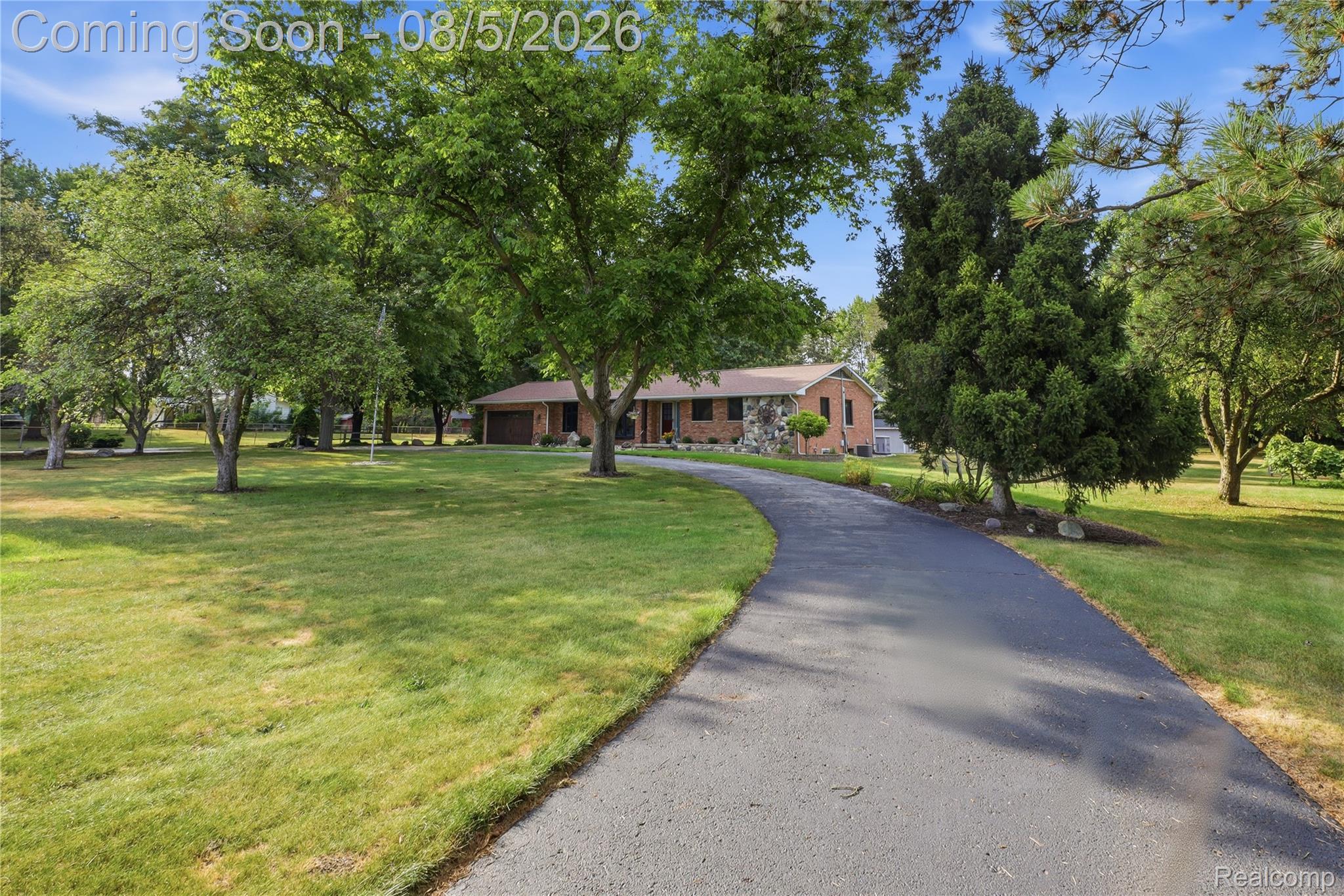 6478 West Stanley Road Mount Morris, MI 48458 - Photo 69 of 80 Asphalt driveway leading to a single-story brick and stone-sided residence