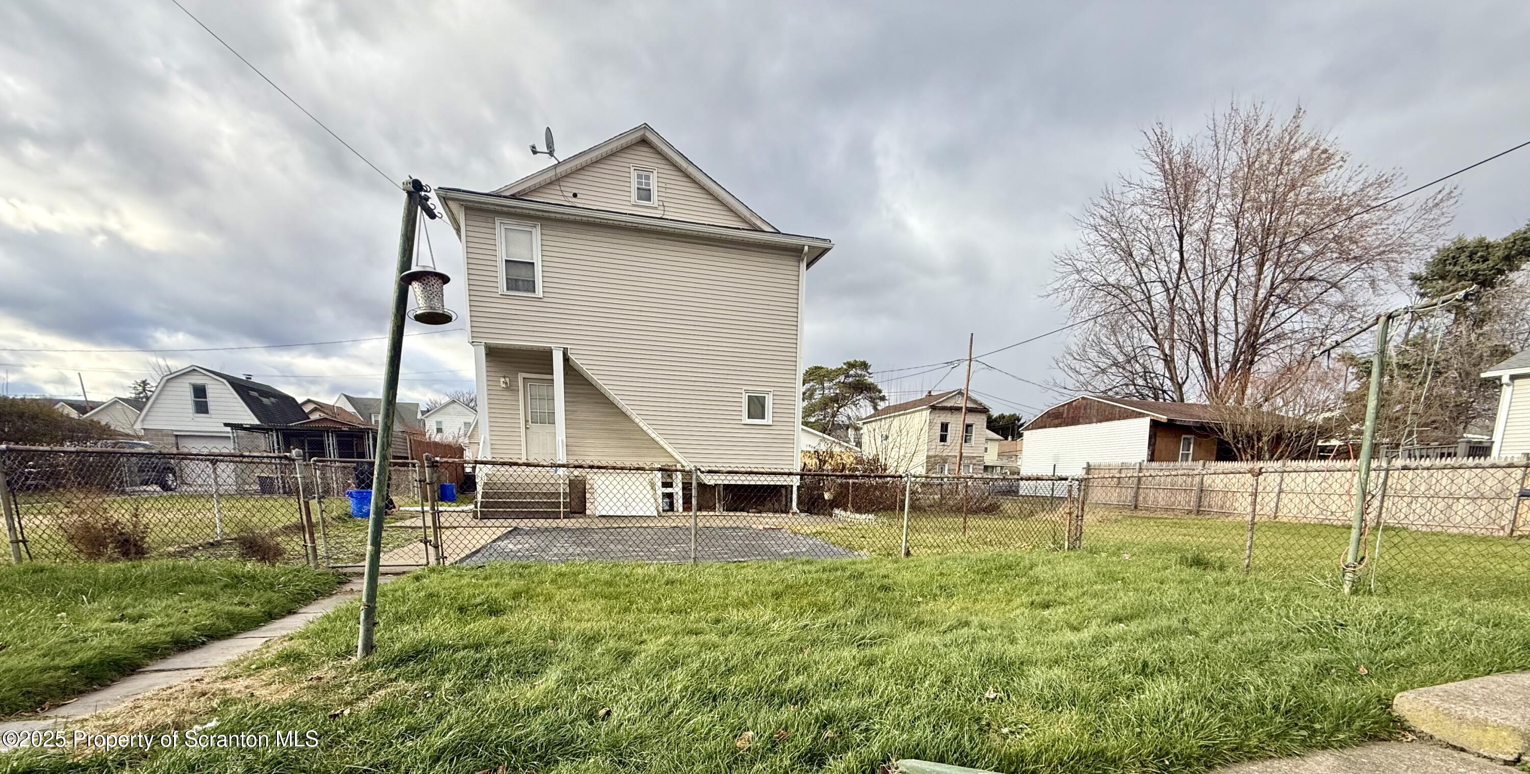 1121 Albright Avenue Scranton, PA 18508 - Photo 12 of 17 a front view of a house with a yard