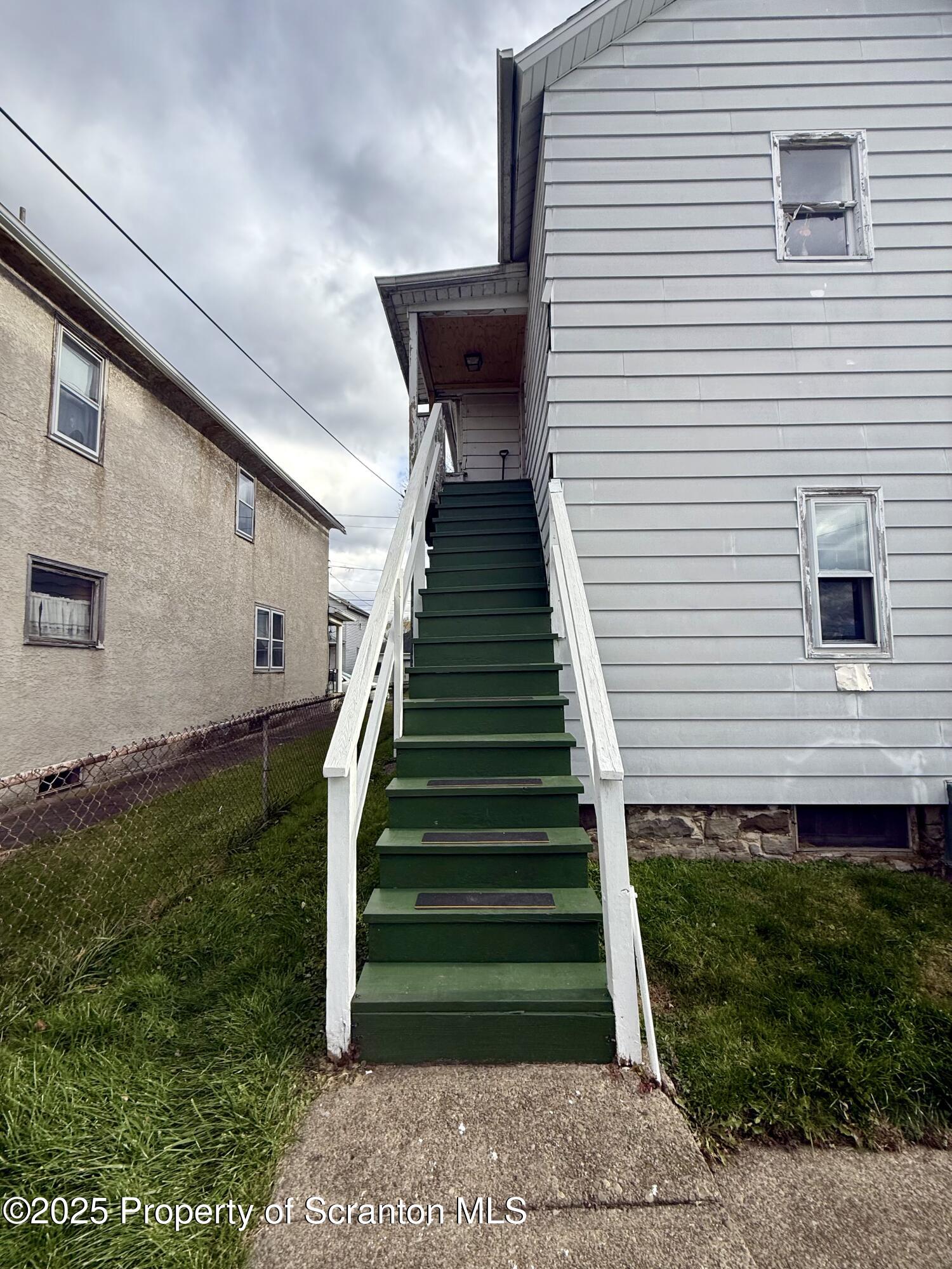 1121 Albright Avenue Scranton, PA 18508 - Photo 13 of 17 a view of a house with a yard