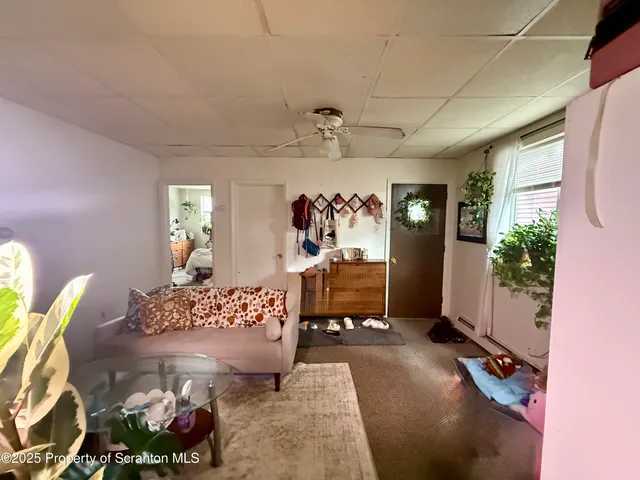 a view of a livingroom with furniture and window
