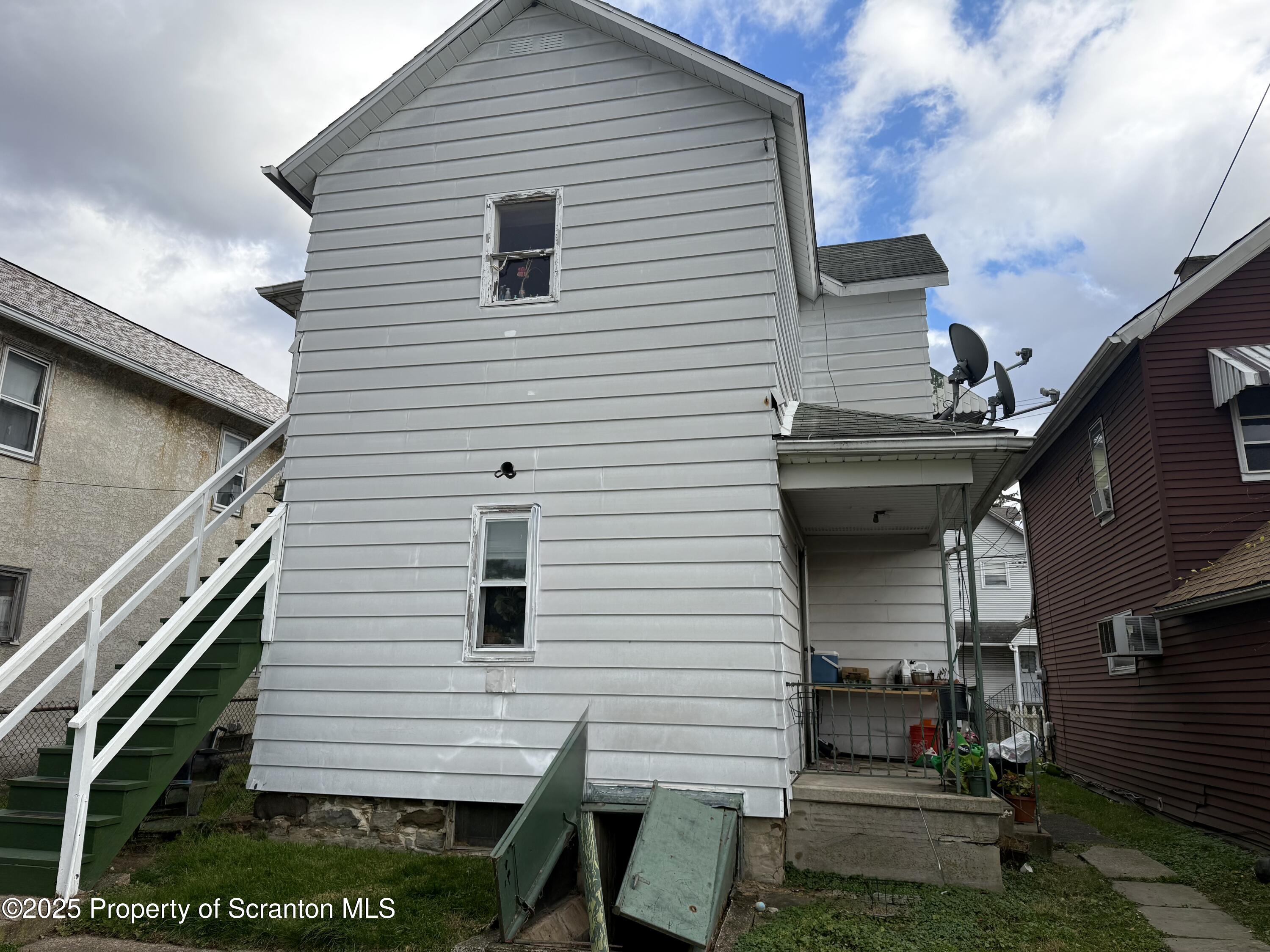 1121 Albright Avenue Scranton, PA 18508 - Photo 8 of 17 a view of house with backyard and a patio