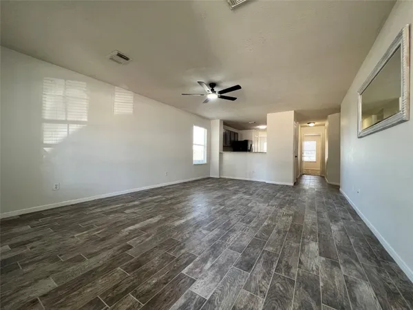 a view of an empty room with a window