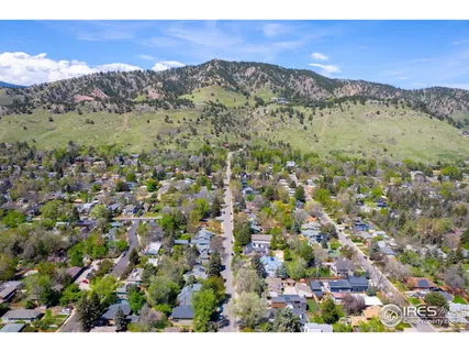 a view of a city with mountains in the background