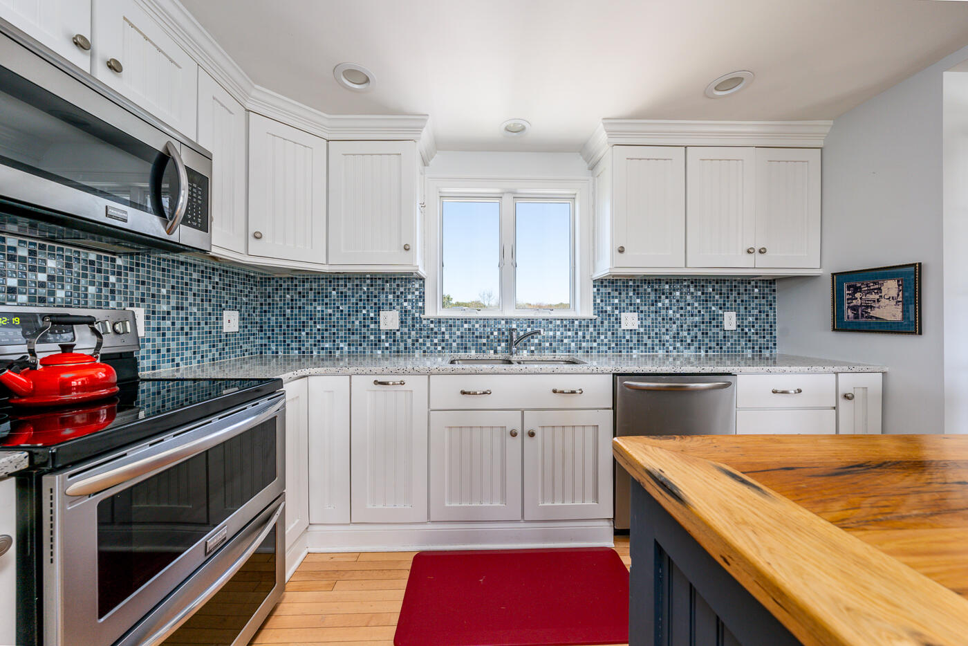 16 Bay View Road Truro, MA 02666 - Photo 13 of 57 a kitchen with stainless steel appliances granite countertop a sink stove and microwave