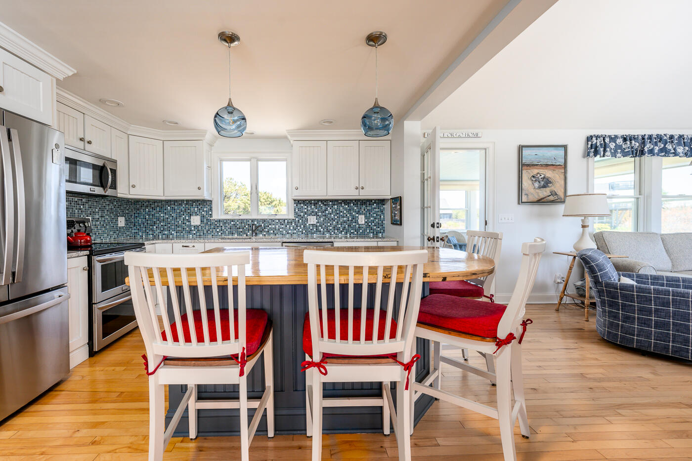 16 Bay View Road Truro, MA 02666 - Photo 14 of 57 a dining room with furniture and wooden floor