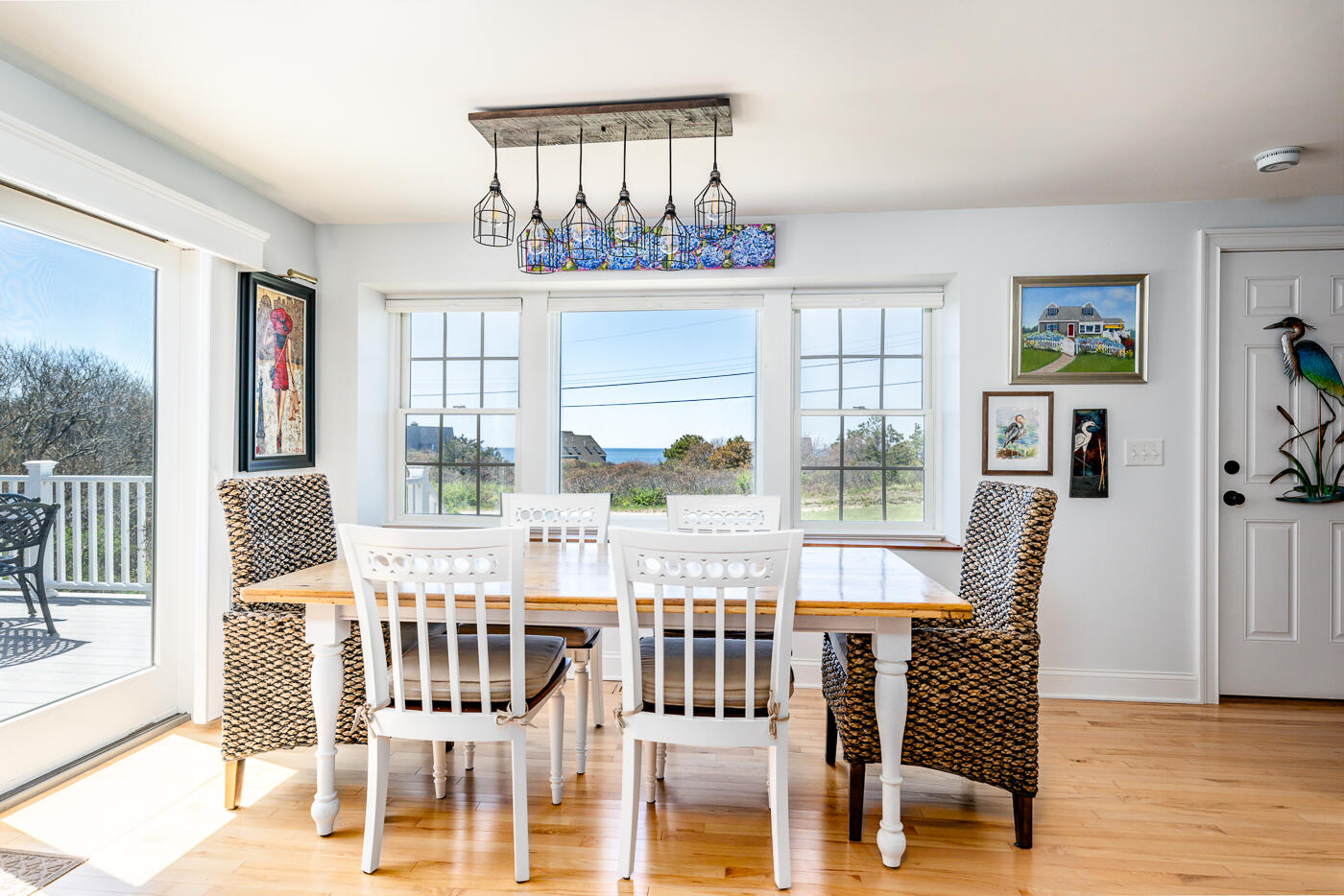 16 Bay View Road Truro, MA 02666 - Photo 15 of 57 a view of a dining room with furniture window and wooden floor