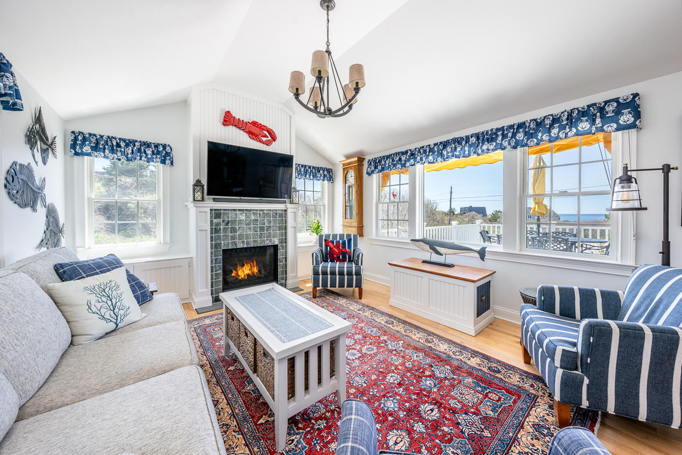 16 Bay View Road Truro, MA 02666 - Photo 21 of 57 a living room with furniture and a fireplace