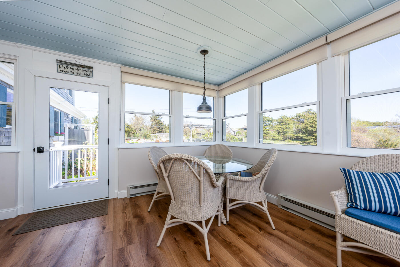 16 Bay View Road Truro, MA 02666 - Photo 27 of 57 a view of a dining room with furniture window and wooden floor