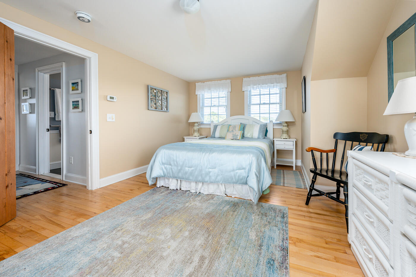 16 Bay View Road Truro, MA 02666 - Photo 33 of 57 a bedroom with a bed and wooden floor