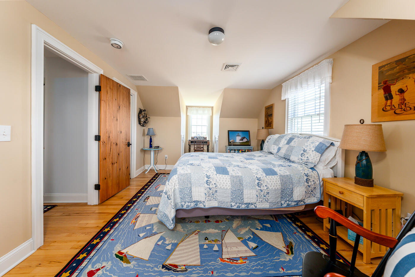 16 Bay View Road Truro, MA 02666 - Photo 37 of 57 a bedroom with a bed and wooden floor
