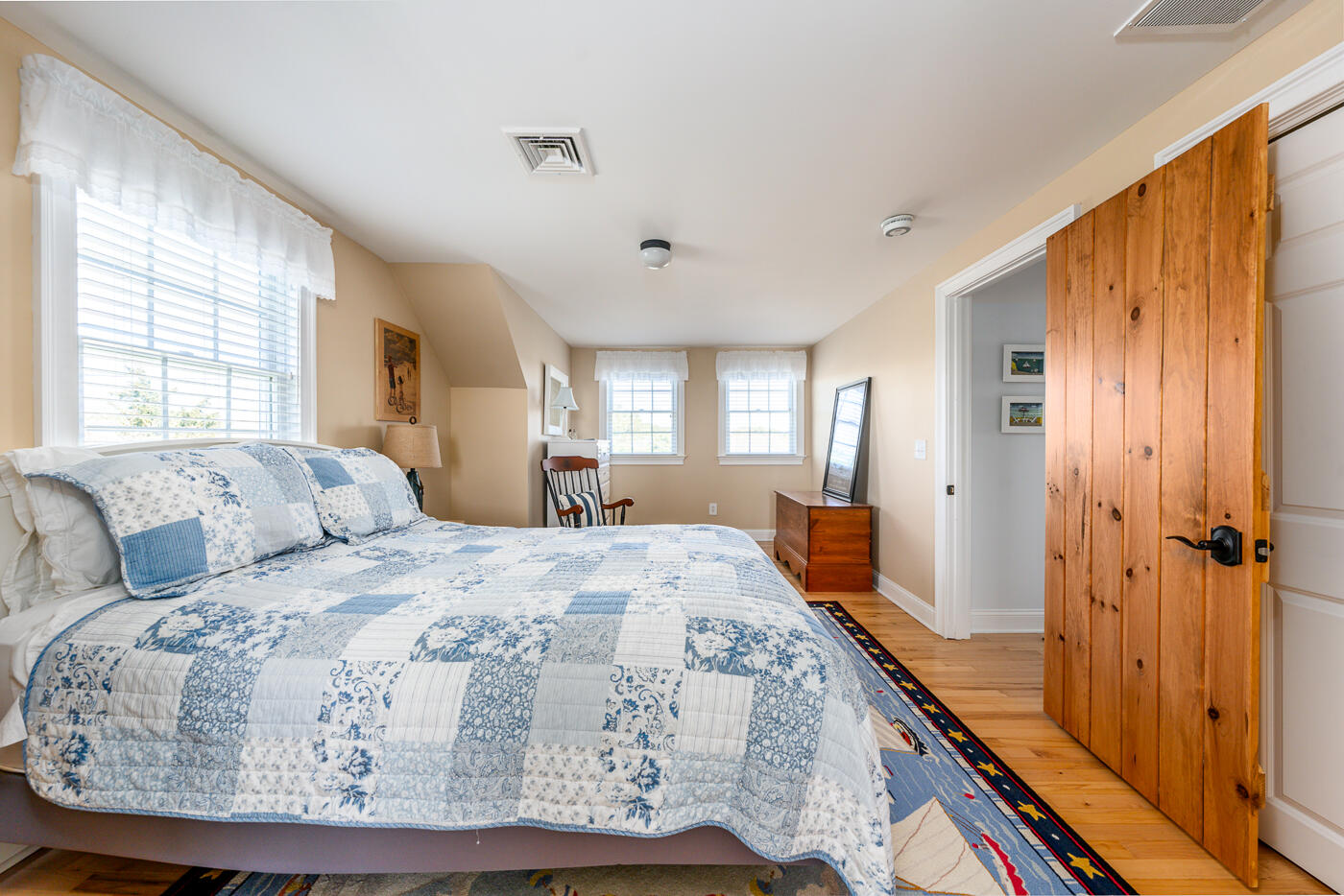 16 Bay View Road Truro, MA 02666 - Photo 38 of 57 a bedroom with a large bed and a dresser