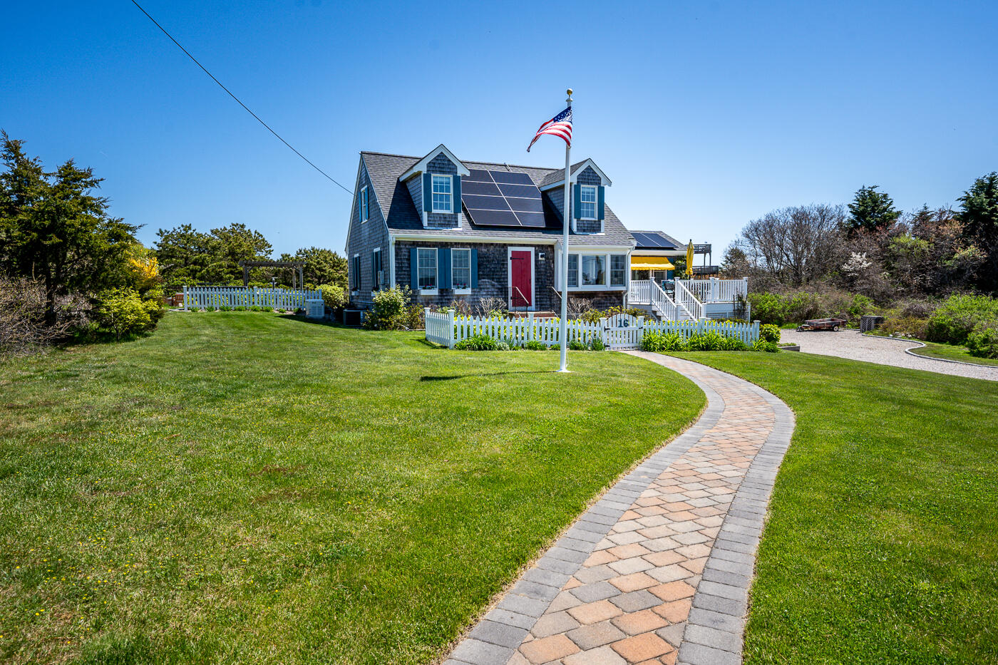 16 Bay View Road Truro, MA 02666 - Photo 4 of 57 a view of a big house with a big yard plants and large trees