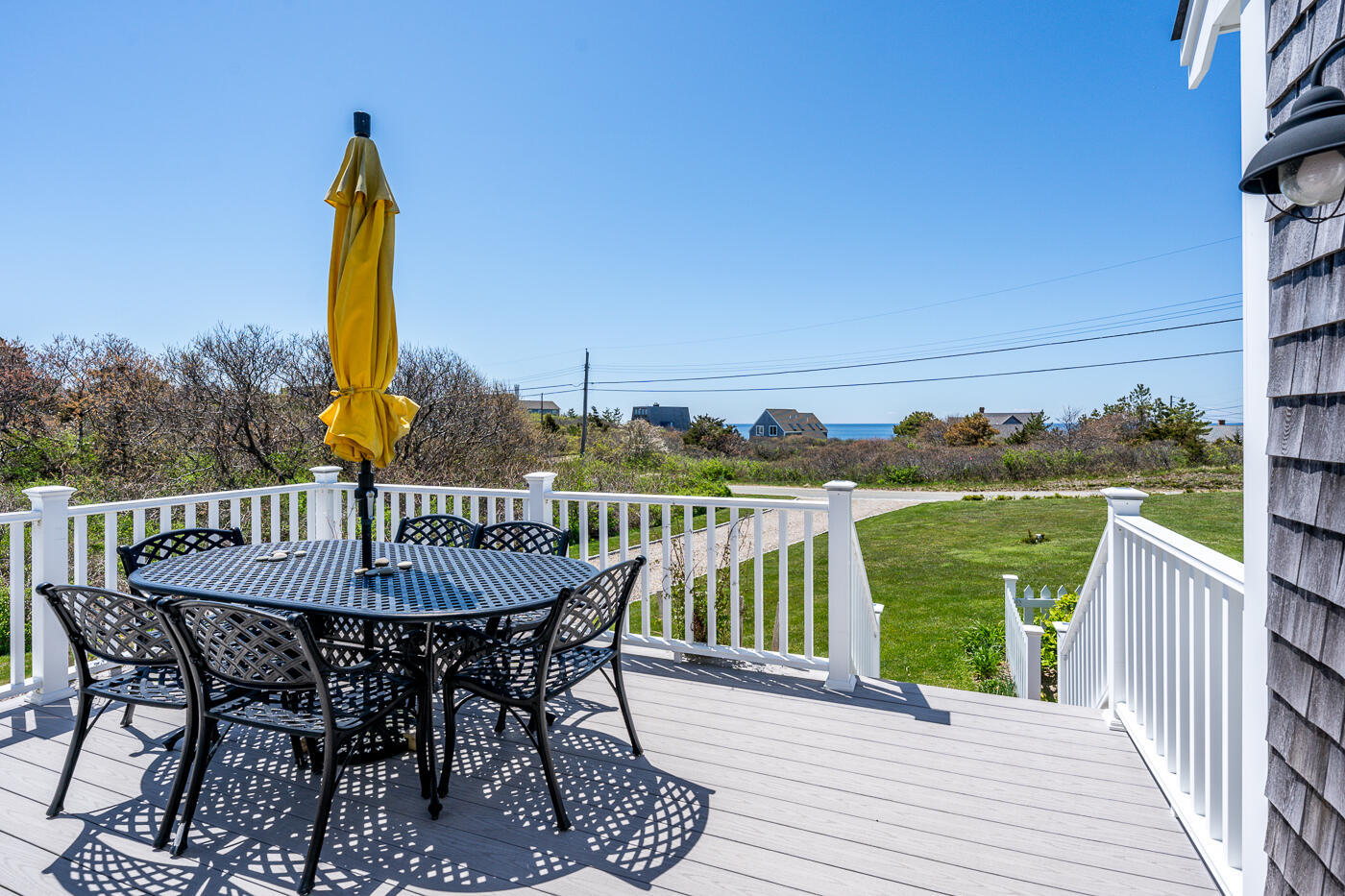 16 Bay View Road Truro, MA 02666 - Photo 42 of 57 a view of a balcony with furniture and wooden floor