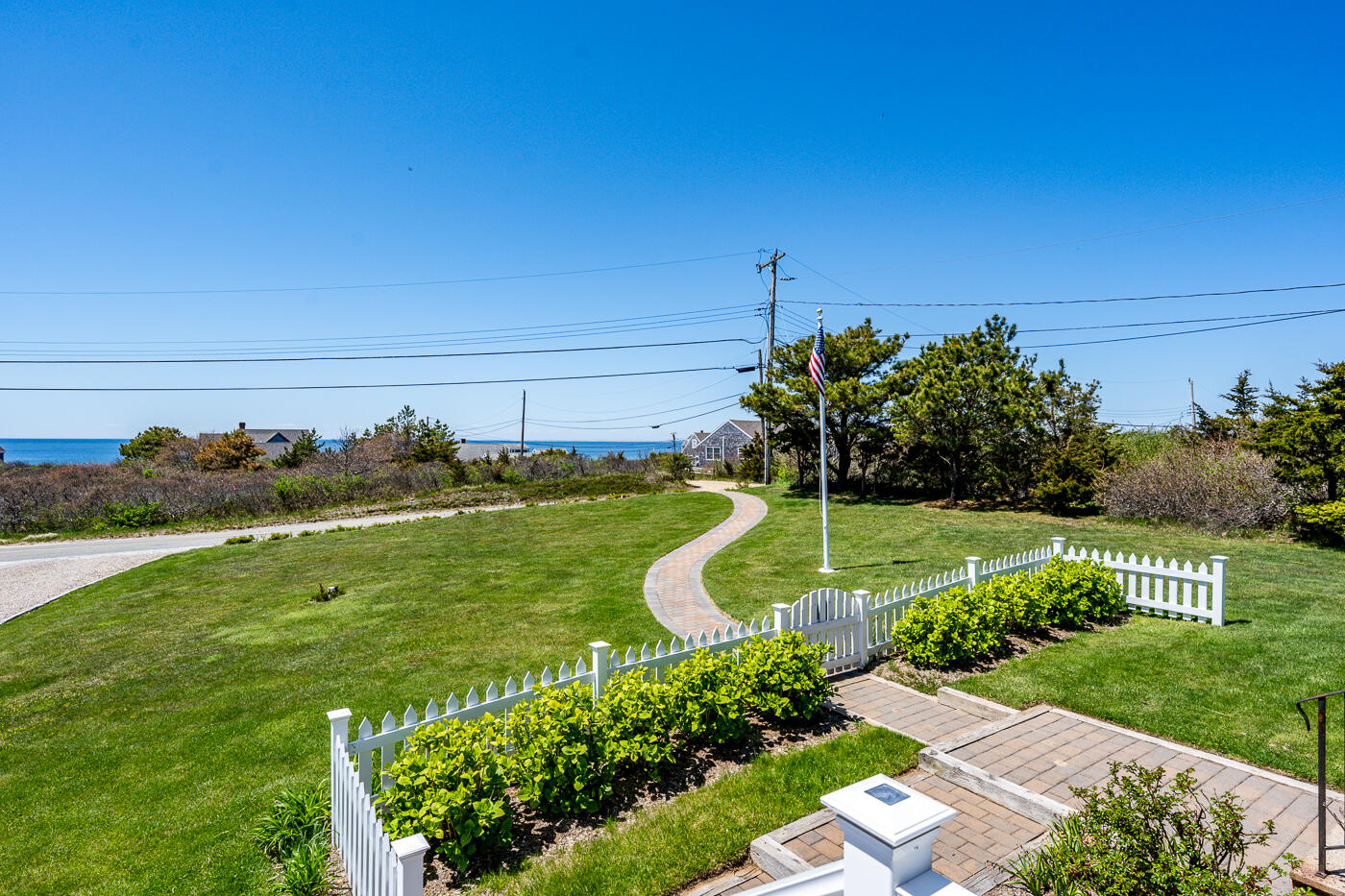 16 Bay View Road Truro, MA 02666 - Photo 44 of 57 a view of a garden with a building in the background