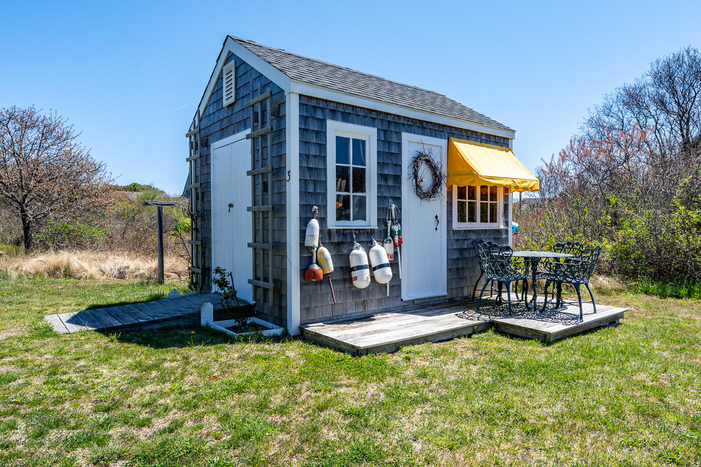 16 Bay View Road Truro, MA 02666 - Photo 45 of 57 a view of a house with backyard porch and sitting area