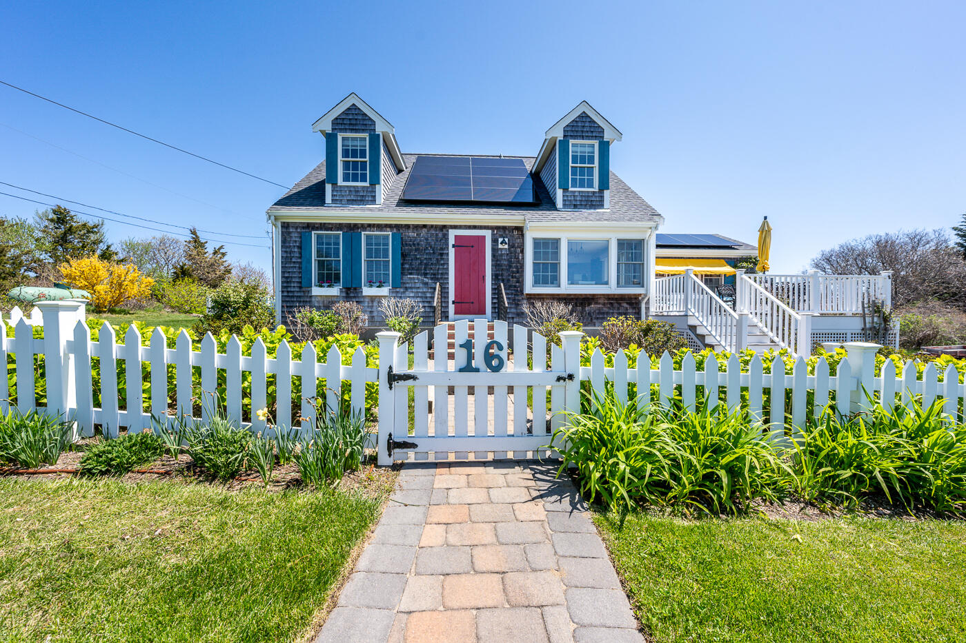16 Bay View Road Truro, MA 02666 - Photo 53 of 57 a front view of a house with a garden