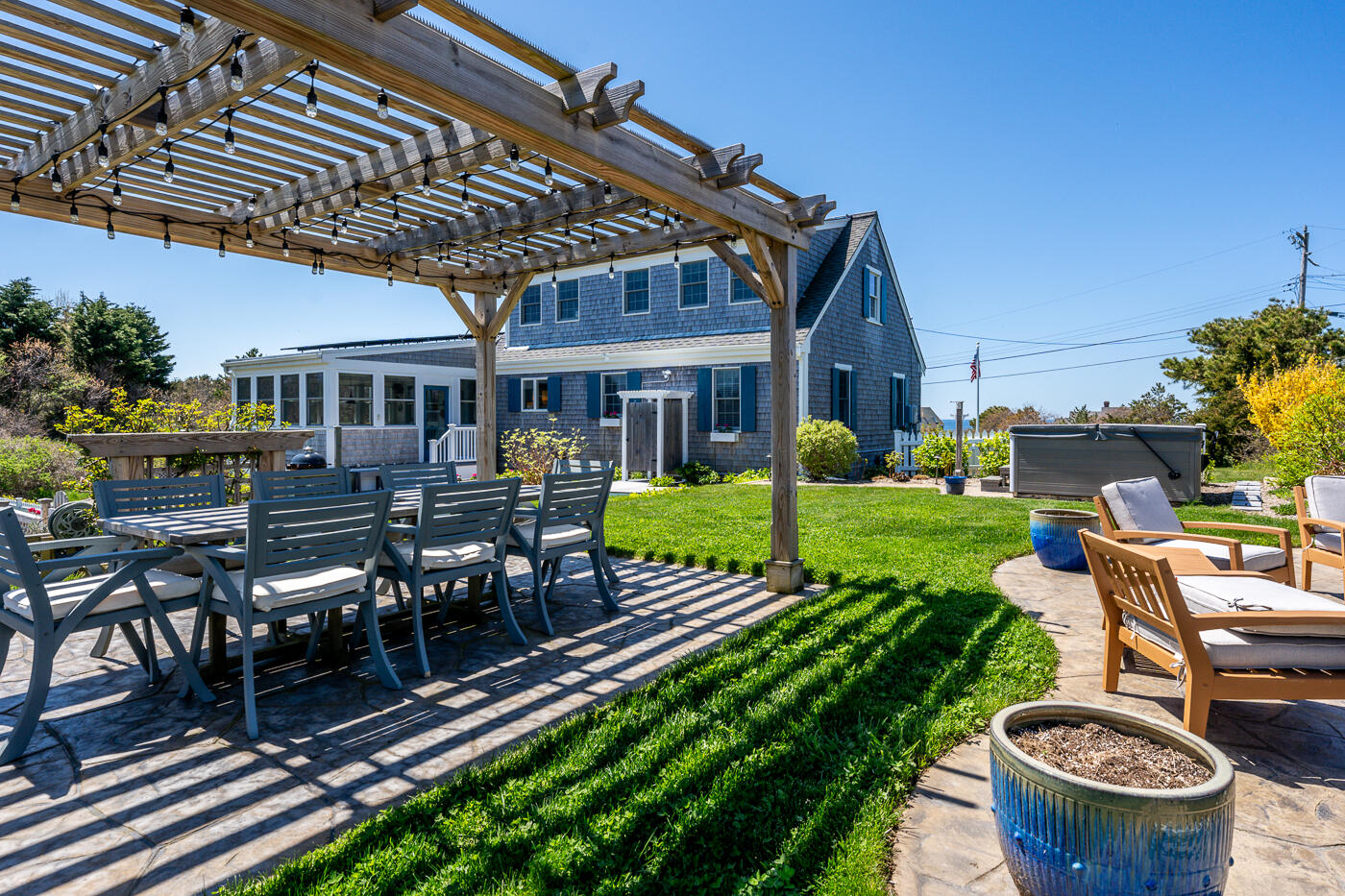 16 Bay View Road Truro, MA 02666 - Photo 10 of 57 a view of a house with backyard sitting area and swimming pool