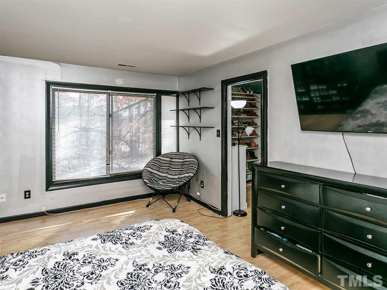 1722 Quail Ridge Road Raleigh, NC 27609 - Photo 13 of 28 a room with furniture and flat screen tv