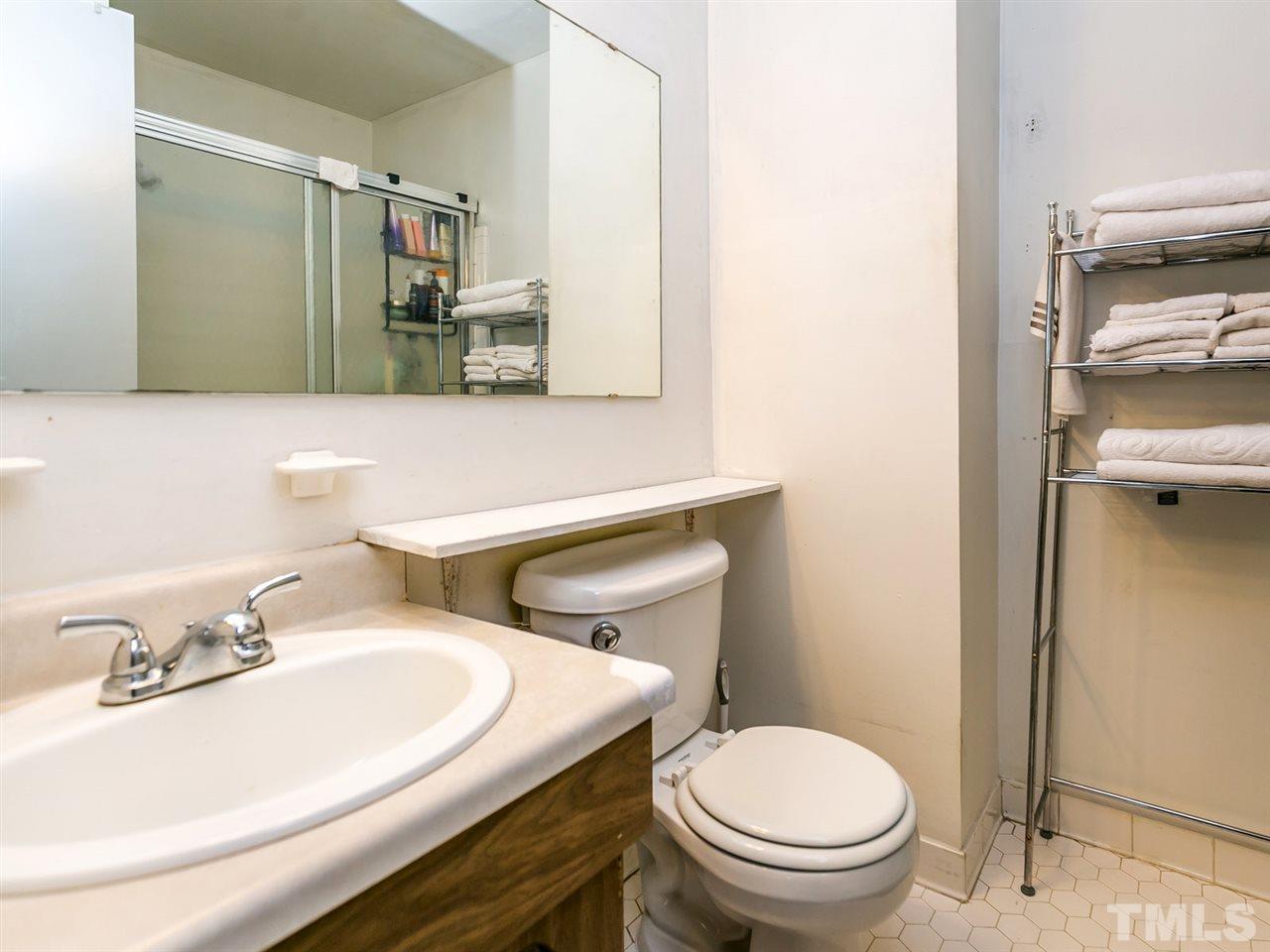 1722 Quail Ridge Road Raleigh, NC 27609 - Photo 16 of 28 a bathroom with a sink and a toilet